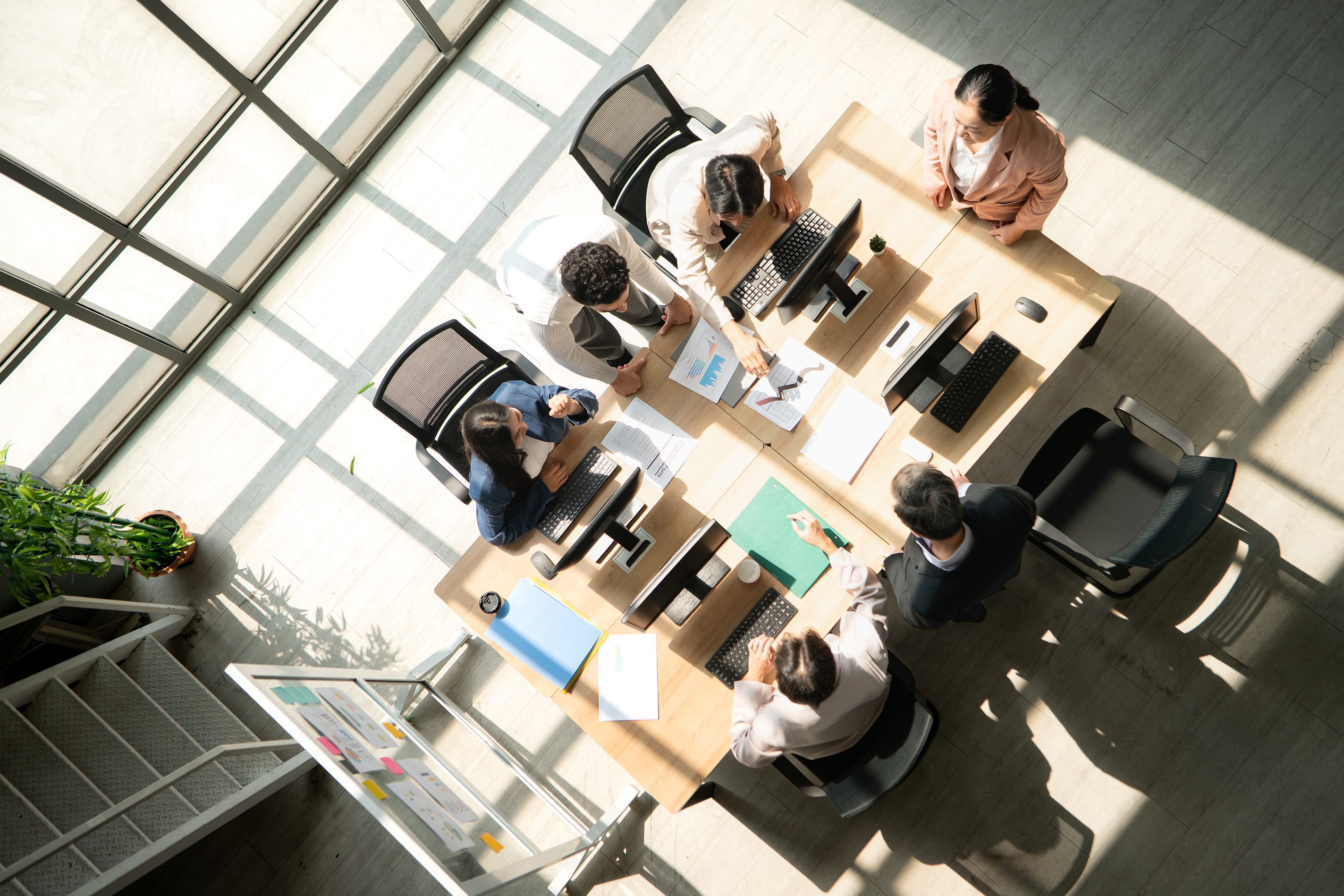Office team collaborating in meeting room