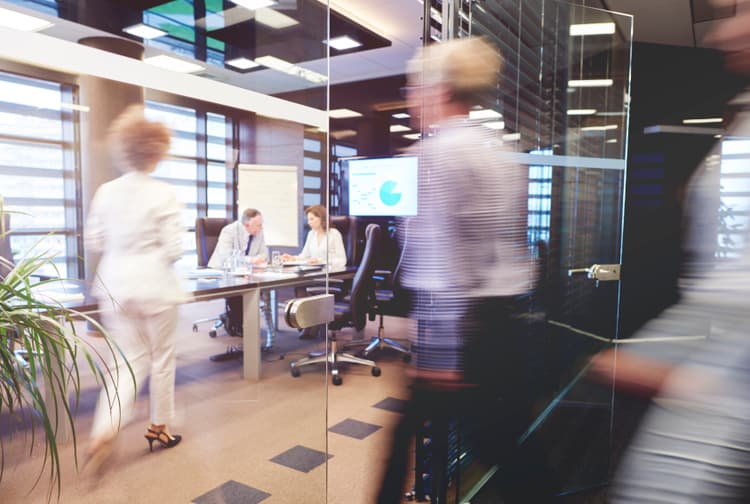 Employees navigating a modern office workspace
